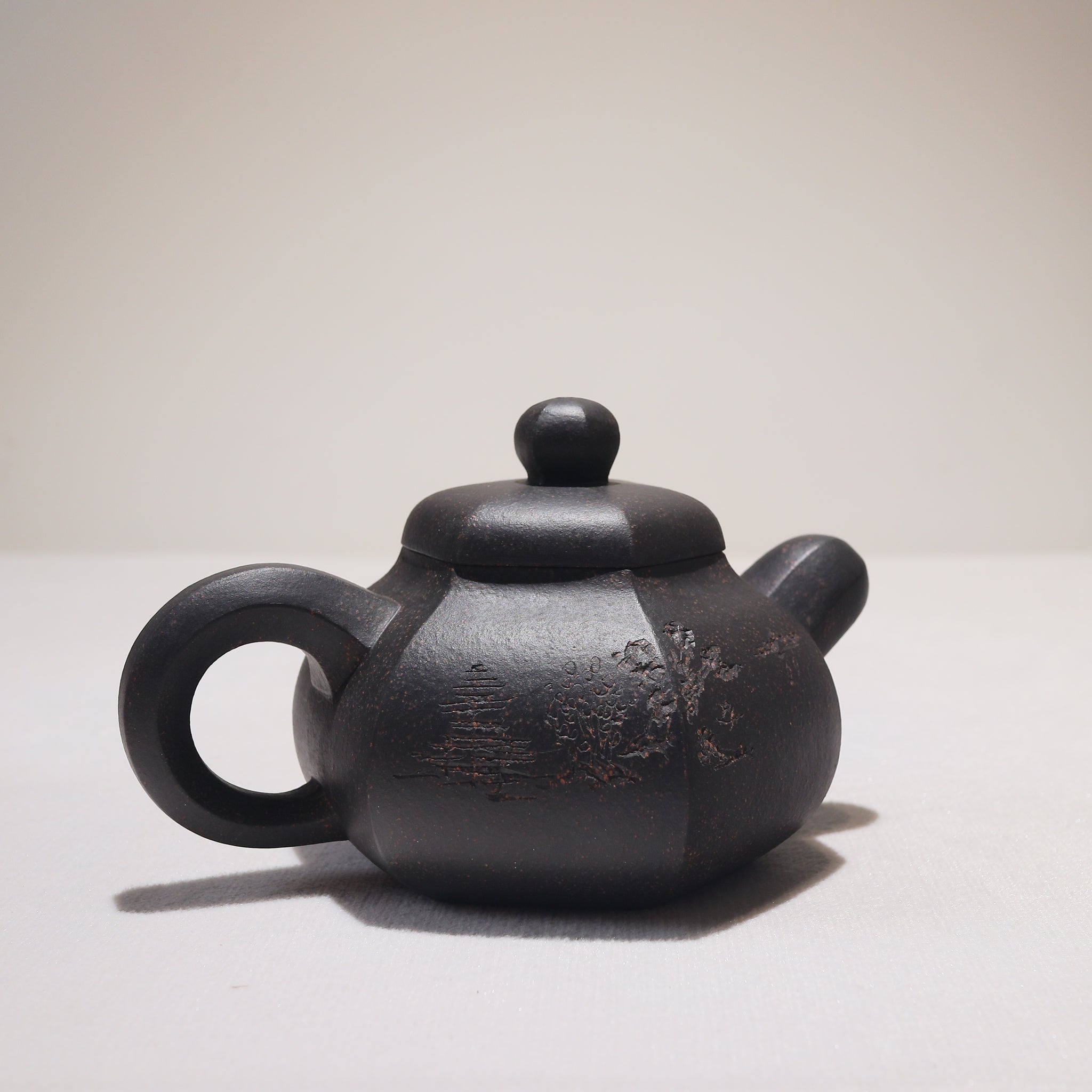 [Six Directions Rongtian] Black gold sand carved calligraphy and painting purple sand teapot